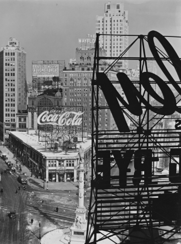 Columbus Circle, Manhattan in 1938, featuring an outdoor Coca-Cola ad.